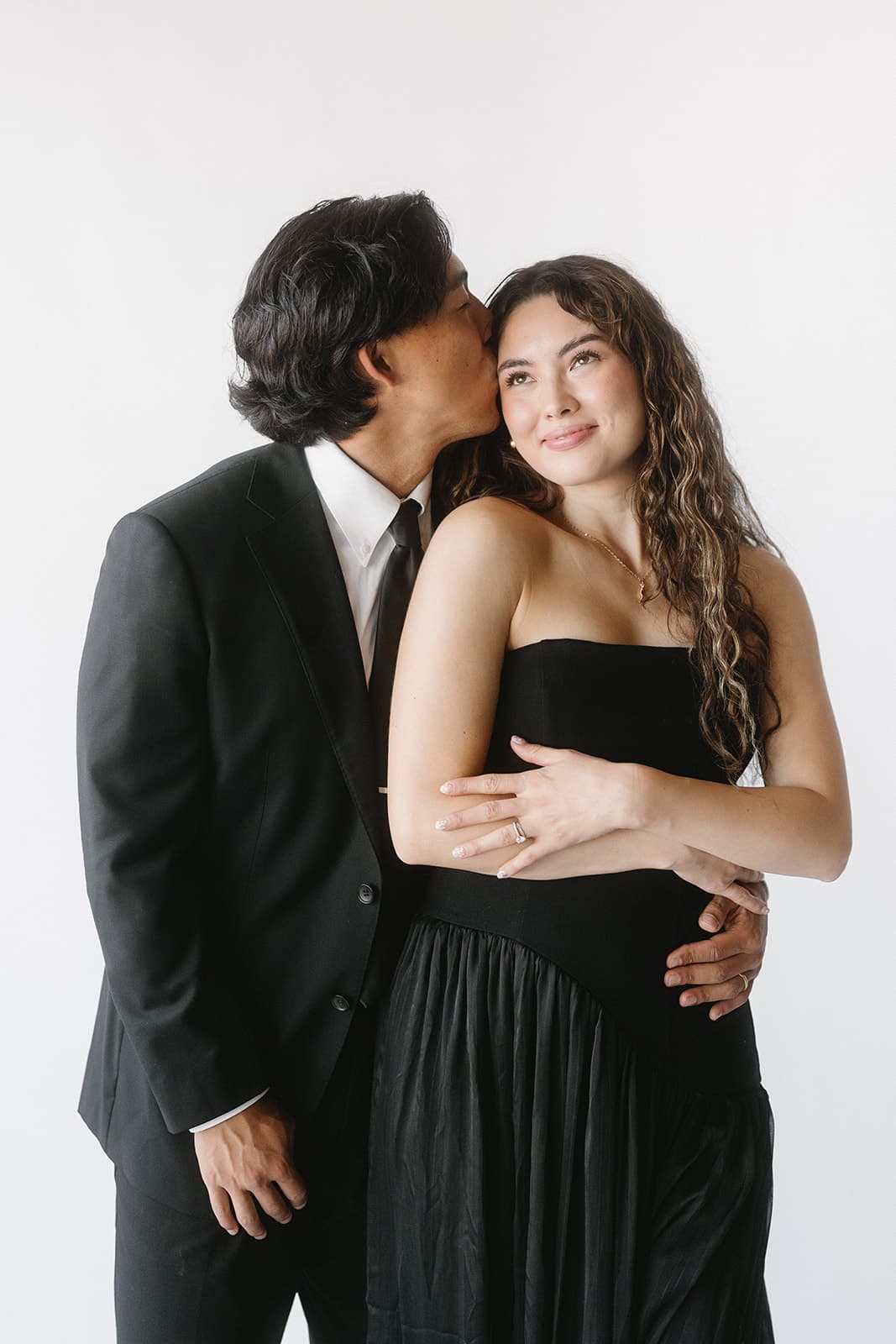 An intimate, unposed moment between a couple at a photo booth experience