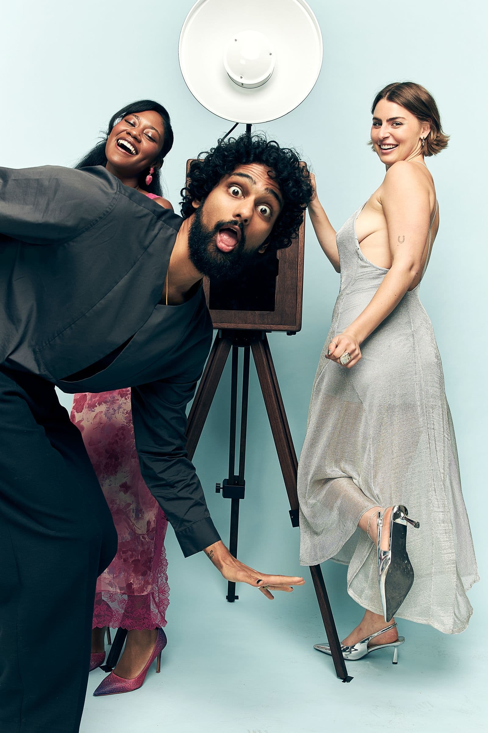 Playful group gathered around the booth